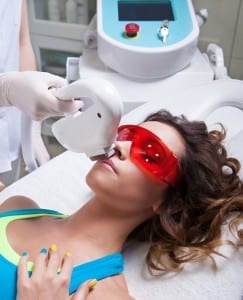 Woman getting face laser treatment, hair removal concept