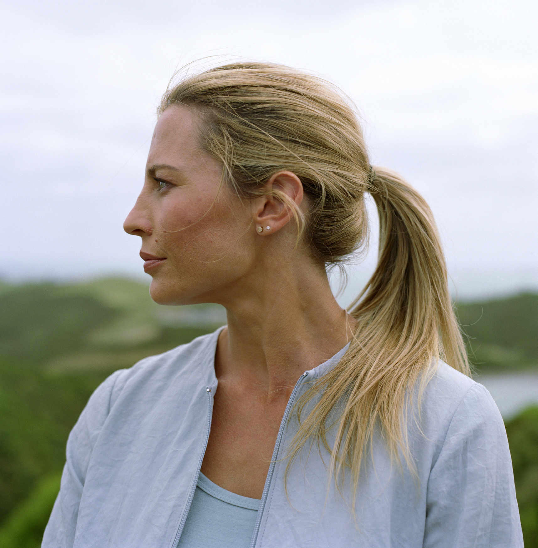 Woman outdoors, profile Isolaz Acne Light Treatment in Pflugerville, TX